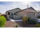 Front yard view of a single story home with gravel and desert plants at 9447 W Glenrosa Ave, Phoenix, AZ 85037