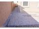 Side yard with paved pathway and gravel at 9447 W Glenrosa Ave, Phoenix, AZ 85037