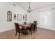 Bright dining room with chandelier and hardwood floors at 9524 W Running Deer Trl, Peoria, AZ 85383