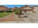 Home features a large driveway and basketball court at 9524 W Running Deer Trl, Peoria, AZ 85383