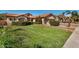 Well-maintained lawn and brick walkway leading to the house at 9524 W Running Deer Trl, Peoria, AZ 85383