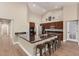 Modern kitchen with granite countertops and wood cabinets at 9524 W Running Deer Trl, Peoria, AZ 85383