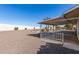 Backyard with gravel, covered patio and mature plants at 9526 W Briarwood N Cir, Sun City, AZ 85351