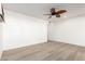 Bright bedroom featuring a ceiling fan and large windows at 9526 W Briarwood N Cir, Sun City, AZ 85351