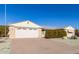 Front view of a single-story home with a two-car garage at 9526 W Briarwood N Cir, Sun City, AZ 85351