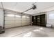 Garage with shelving, overhead door and storage at 9526 W Briarwood N Cir, Sun City, AZ 85351