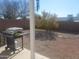 Backyard patio area with gas grill and view of gravel landscaping at 9541 E Fairbrook St, Mesa, AZ 85207