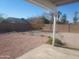 Backyard view from patio, showing gravel landscaping and rock features at 9541 E Fairbrook St, Mesa, AZ 85207