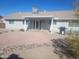 Spacious backyard with covered patio, gravel landscaping, and rock borders at 9541 E Fairbrook St, Mesa, AZ 85207