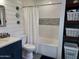 Updated bathroom with white subway tile and bathtub at 9541 E Fairbrook St, Mesa, AZ 85207