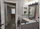 Modern bathroom boasts shiplap walls and a glass shower at 9541 E Fairbrook St, Mesa, AZ 85207