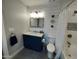 Modern bathroom with navy vanity and walk-in shower at 9541 E Fairbrook St, Mesa, AZ 85207