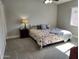 Spacious bedroom with king-size bed and walk-in closet at 9541 E Fairbrook St, Mesa, AZ 85207