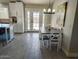 Bright dining area with table and chairs, adjacent to kitchen at 9541 E Fairbrook St, Mesa, AZ 85207