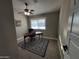 Bright home office features a desk, window, and stylish rug at 9541 E Fairbrook St, Mesa, AZ 85207