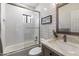 Clean bathroom with a tub shower combo and marble vanity at 9915 E Cinnabar Ave, Scottsdale, AZ 85258