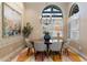 Bright dining room features a round table and modern chandelier at 9915 E Cinnabar Ave, Scottsdale, AZ 85258