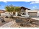 Beautiful desert landscaping highlights this updated single-level home at 9915 E Cinnabar Ave, Scottsdale, AZ 85258