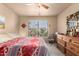 Bedroom with queen bed, window with blinds, and wood dresser at 9990 N Scottsdale Rd # 2048, Paradise Valley, AZ 85253