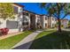 Condo building exterior showcasing a walkway and lawn at 9990 N Scottsdale Rd # 2048, Paradise Valley, AZ 85253