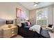 Charming bedroom with a black and gold color scheme and plenty of natural light at 11748 N 80Th Pl, Scottsdale, AZ 85260