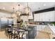 Modern kitchen with white cabinets, a large island, and stainless steel appliances at 11748 N 80Th Pl, Scottsdale, AZ 85260