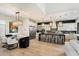 Modern kitchen with white cabinets, large island, and high-end appliances at 11748 N 80Th Pl, Scottsdale, AZ 85260