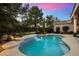 Inviting freeform pool with a waterfall feature and ample patio space at 11748 N 80Th Pl, Scottsdale, AZ 85260