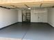 Garage with overhead storage and epoxy floor at 10240 N 65Th Ln, Glendale, AZ 85302