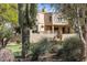 Backyard of home with putting green and desert landscaping at 10420 E Morning Vista Ln, Scottsdale, AZ 85262