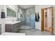 Tiled shower with glass door, modern lighting and fixtures at 10420 E Morning Vista Ln, Scottsdale, AZ 85262