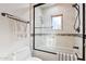 Modern bathroom featuring a glass-enclosed shower and neutral tile at 10420 E Morning Vista Ln, Scottsdale, AZ 85262