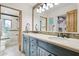 Bathroom showcasing dual sinks, a large mirror, and neutral decor at 10420 E Morning Vista Ln, Scottsdale, AZ 85262