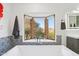 A soaking tub with a view from the bay window at 10420 E Morning Vista Ln, Scottsdale, AZ 85262