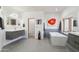 Stylish bathroom featuring double sinks, a soaking tub with tile backsplash, and modern fixtures at 10420 E Morning Vista Ln, Scottsdale, AZ 85262