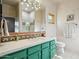 Stylish bathroom with decorative tiles, modern fixtures, and a large vanity mirror at 10420 E Morning Vista Ln, Scottsdale, AZ 85262