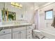 Vintage bathroom with colorful floral tiles, ornate mirror, and shower at 10420 E Morning Vista Ln, Scottsdale, AZ 85262