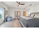 Bright bedroom with hardwood floors, a large bed and comfortable bean bag at 10420 E Morning Vista Ln, Scottsdale, AZ 85262