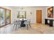 Eat-in dining area, featuring a round table, stylish chairs, bay window, and wood-look flooring at 10420 E Morning Vista Ln, Scottsdale, AZ 85262