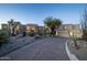 Long driveway leading to a luxurious home with desert landscaping at 10420 E Morning Vista Ln, Scottsdale, AZ 85262