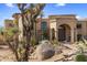 Stunning exterior elevation showcasing the desert landscaping and architecture at 10420 E Morning Vista Ln, Scottsdale, AZ 85262