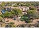 Beautiful home featuring a putting green, desert landscaping, and an inviting outdoor space at 10420 E Morning Vista Ln, Scottsdale, AZ 85262