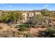 Beautiful home featuring a putting green, desert landscaping, and an inviting outdoor space at 10420 E Morning Vista Ln, Scottsdale, AZ 85262
