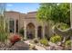 Landscaped front exterior with desert plants and architecture, a welcoming entrance at 10420 E Morning Vista Ln, Scottsdale, AZ 85262