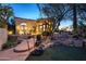 Charming front yard with a walkway, pond, and desert landscaping at 10420 E Morning Vista Ln, Scottsdale, AZ 85262