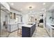 Bright kitchen with white countertops, stainless steel appliances, and a large island with seating at 10420 E Morning Vista Ln, Scottsdale, AZ 85262