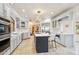 Bright kitchen with white countertops, stainless steel appliances, and a large island with seating at 10420 E Morning Vista Ln, Scottsdale, AZ 85262