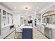 Bright kitchen with white countertops, ample cabinet space, and a large island with seating at 10420 E Morning Vista Ln, Scottsdale, AZ 85262