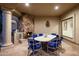 Outdoor patio with fireplace, dining area, and built-in grill at 10420 E Morning Vista Ln, Scottsdale, AZ 85262