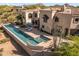 Beautiful backyard pool with attached spa, lounge chairs, and desert landscaping in a luxury home at 10420 E Morning Vista Ln, Scottsdale, AZ 85262